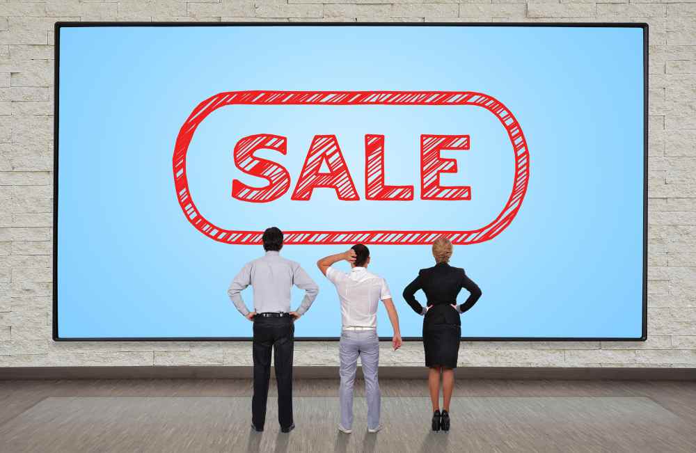 people in front of big LED screen display